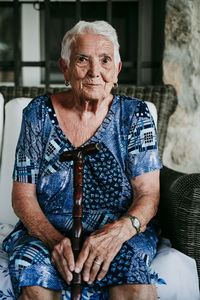 Close-up portrait of senior woman sitting