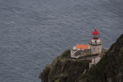 High angle view of lighthouse by sea