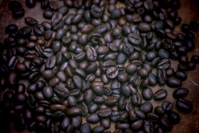 High angle view of roasted coffee beans on table