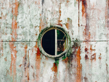 Old circular window on building