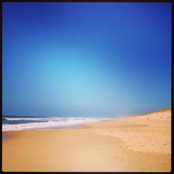 Scenic view of sea against clear sky