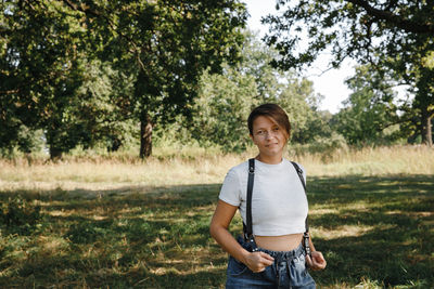 Leather belts. portrait of the photographer, a woman stands with her face