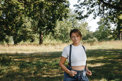 Portrait of smiling boy standing on land