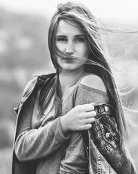 Portrait of young woman with long hair