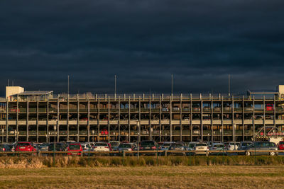People on field against sky during sunset