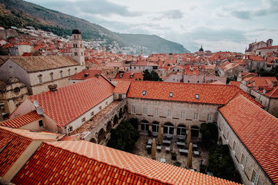 High angle view of buildings in town against sky