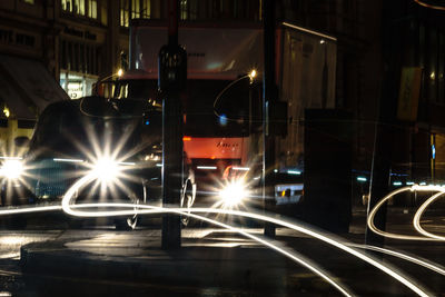 Illuminated train at night