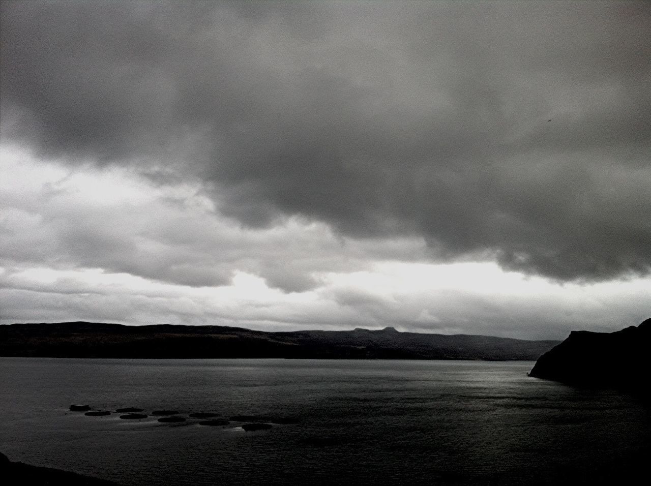 sky, cloud - sky, cloudy, tranquil scene, scenics, tranquility, water, beauty in nature, weather, overcast, nature, mountain, cloud, storm cloud, dusk, sea, landscape, idyllic, lake, outdoors