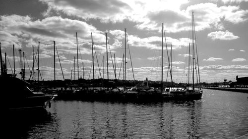 Boats moored at harbor