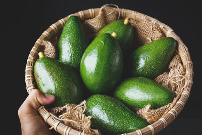 Close-up of hand holding strawberries