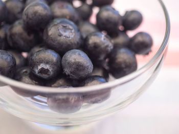 Close-up of fruits in glass bowl on table