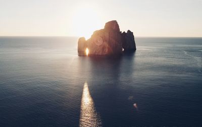 Scenic view of sea against clear sky during sunset