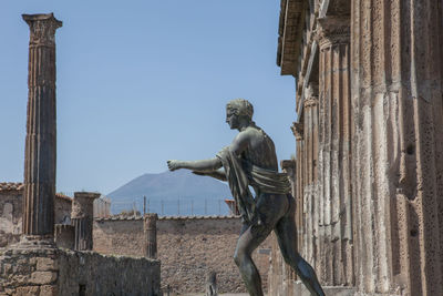 Low angle view of statue against sky