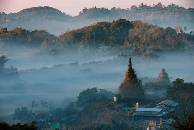 High angle view of trees and buildings against sky