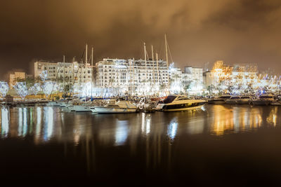 Boats moored at harbor
