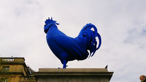 Low angle view of built structure against blue sky