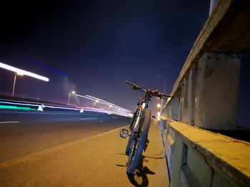 Vehicles on road in city at night