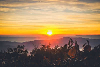 Scenic view of sunset over mountains