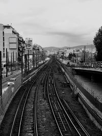 High angle view of railroad tracks amidst buildings in city