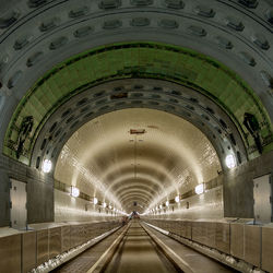 Illuminated tunnel at railroad station