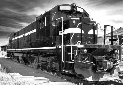 Train on railroad track against sky