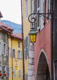 Yellow road sign against built structure