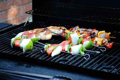 Close-up of food in skewers on barbecue grill