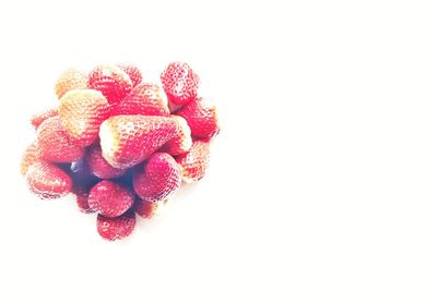 Close-up of strawberry over white background