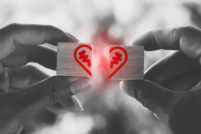 Close-up of hands holding heart shape