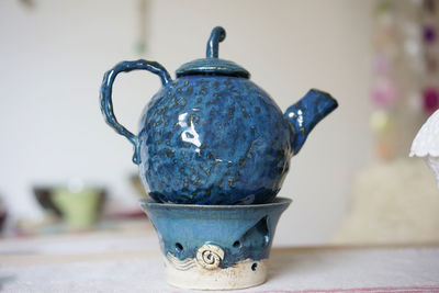 Close-up of teapot on table