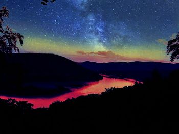 Scenic view of landscape against sky at night