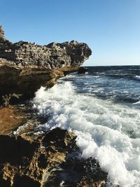 Scenic view of sea against clear blue sky