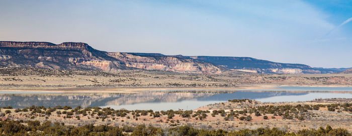 Panoramic view of lake and mountains against sky