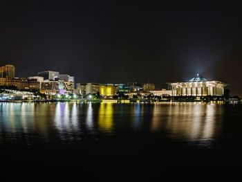 Illuminated city at waterfront