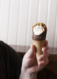 Close-up of hand holding ice cream cone