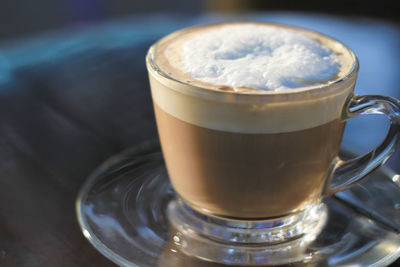 Close-up of cappuccino on table