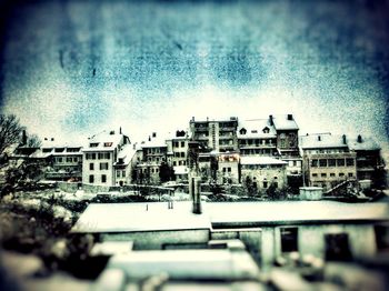 Houses against sky in city