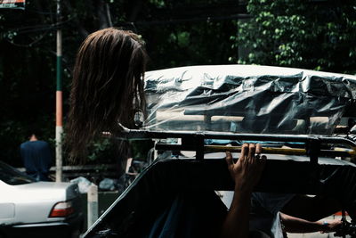 Rear view of woman in car