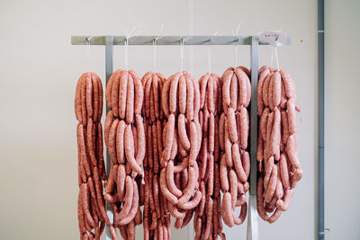 Close-up of roasted hanging for sale