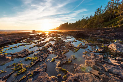 Scenic view of rocks against sky during sunset