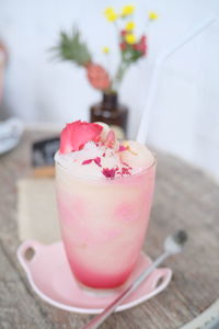 Close-up of pink fruit on table