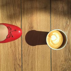 Close-up of coffee cup on wooden table