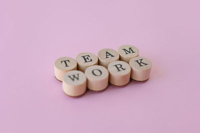 Close-up of heart shape over pink background