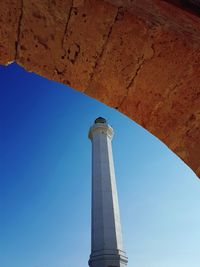 Low angle view of tower against clear blue sky