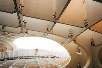 Staircase against sky seen from ceiling