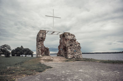 Traditional windmill against sky