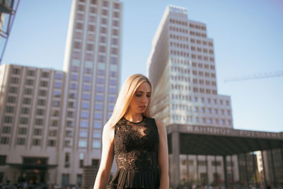 Young woman standing in city