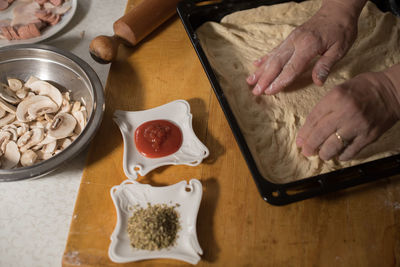 High angle view of person preparing food on table