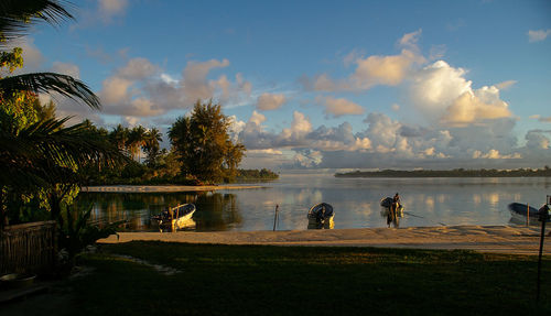 Scenic view of lake against cloudy sky