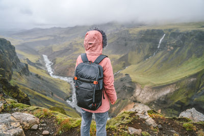 Full length of senior man with mountains in background